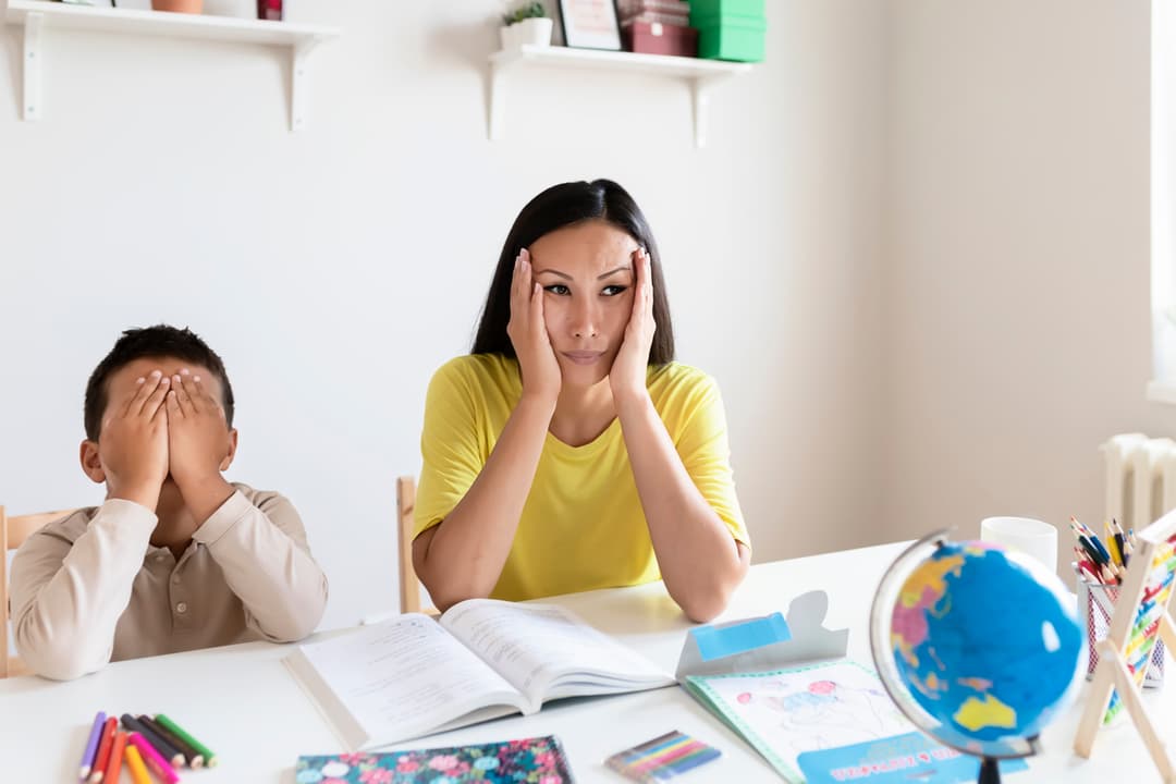 Stressed mother and son frustrated over homework